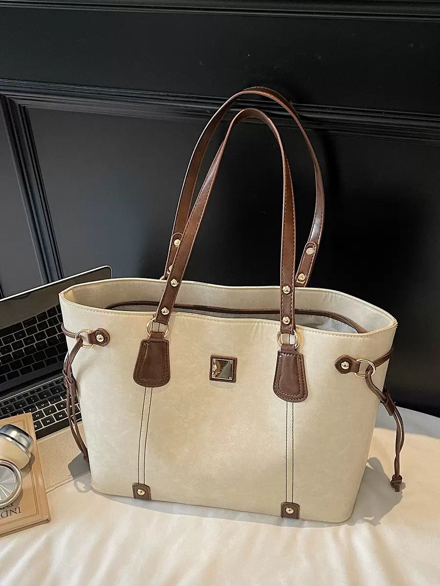 Elegant Beige Tote Bag with Brown Leather Handles