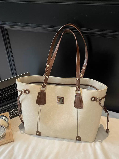 Elegant Beige Tote Bag with Brown Leather Handles