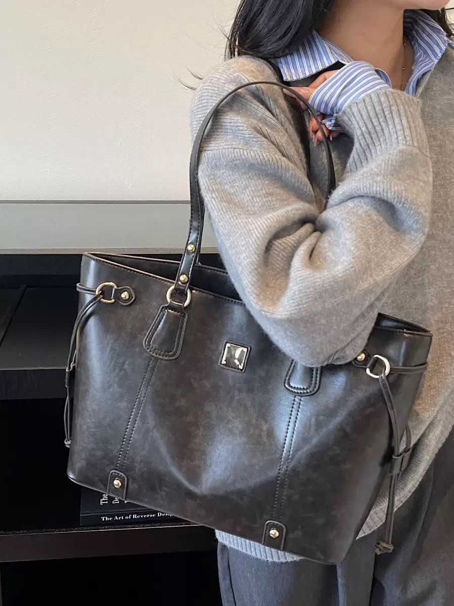 Elegant Beige Tote Bag with Brown Leather Handles