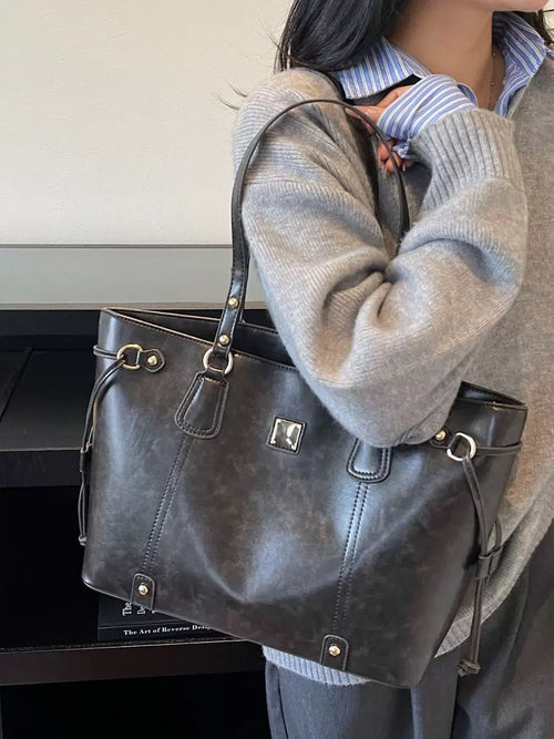 Elegant Beige Tote Bag with Brown Leather Handles