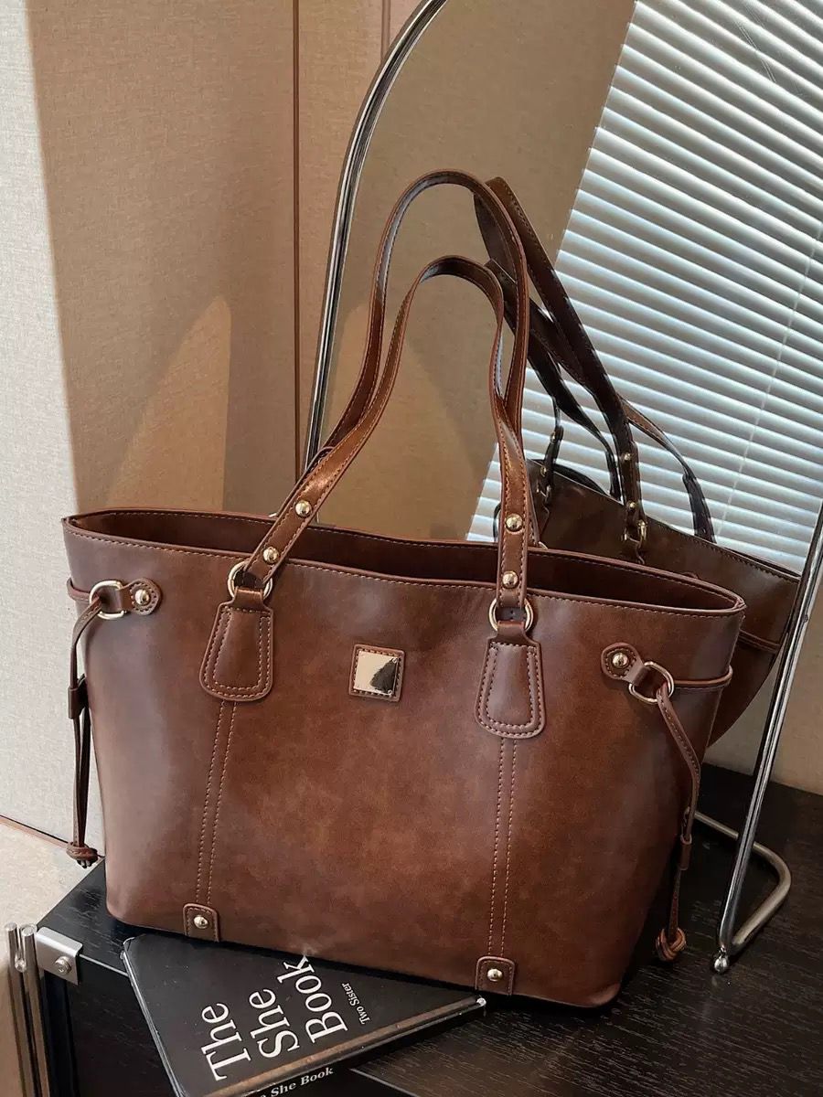 Elegant Beige Tote Bag with Brown Leather Handles